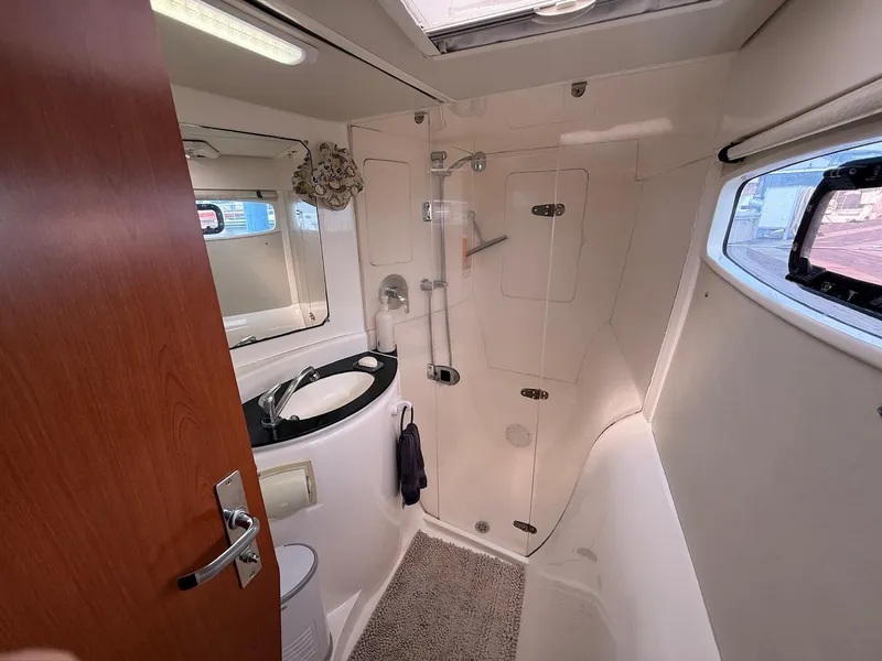Slide: The Image of Bathroom interior of 2012 Leopard 39 Owner's Version yacht, featuring shower and sink. - 44