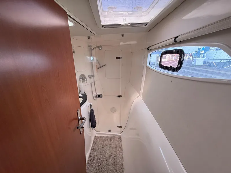 Slide: The Image of Bathroom interior of 2012 Leopard 39 Owner's Version yacht, featuring shower and window. - 45
