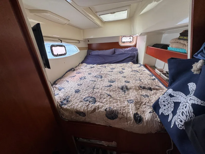 Slide: The Image of Cozy bedroom in 2012 Leopard 39 Owner's Version yacht with nautical decor. - 48