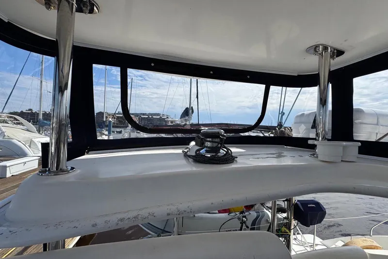 Slide: The Image of Interior view of 2012 Leopard 39 Owner's Version yacht, showcasing helm and marina backdrop. - 61