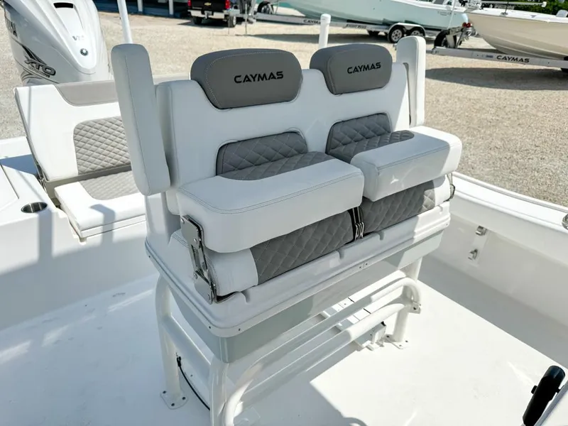 Slide: The Image of 2024 Caymas 28 HB boat seating with gray and white cushioned design. - 15