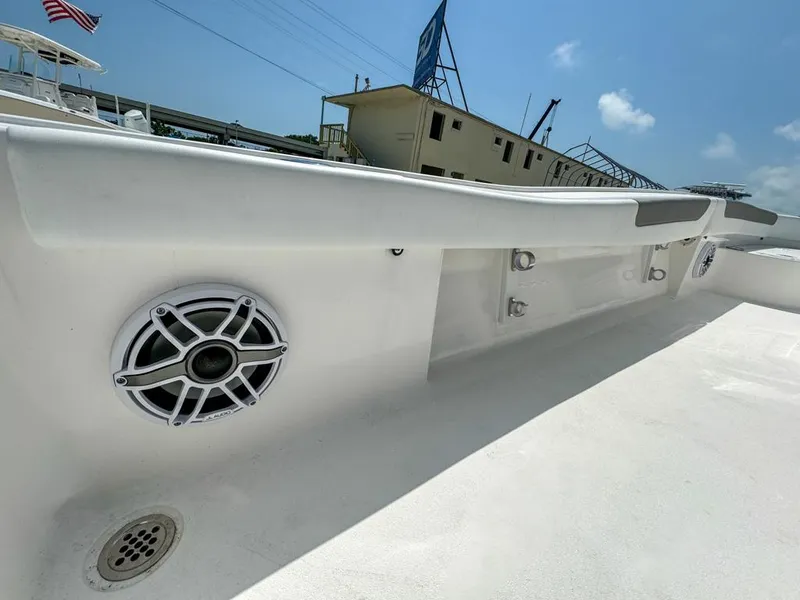 Slide: The Image of 2024 Caymas 28 HB boat interior with speakers and storage compartments. - 25