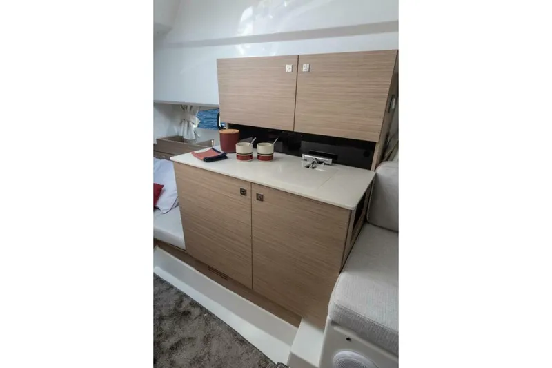 Slide: The Image of 2025 Jeanneau Leader 9.0 WA Series 2 interior with modern cabinetry and sink. - 12