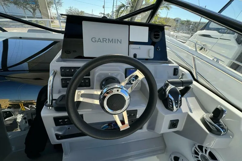 Slide: The Image of Helm of 2025 Jeanneau Leader 9.0 WA Series 2 with Garmin navigation system. - 6