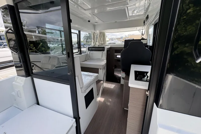 Slide: The Image of Interior view of 2026 Jeanneau NC 895 Series 2 boat, featuring modern seating and helm. - 3