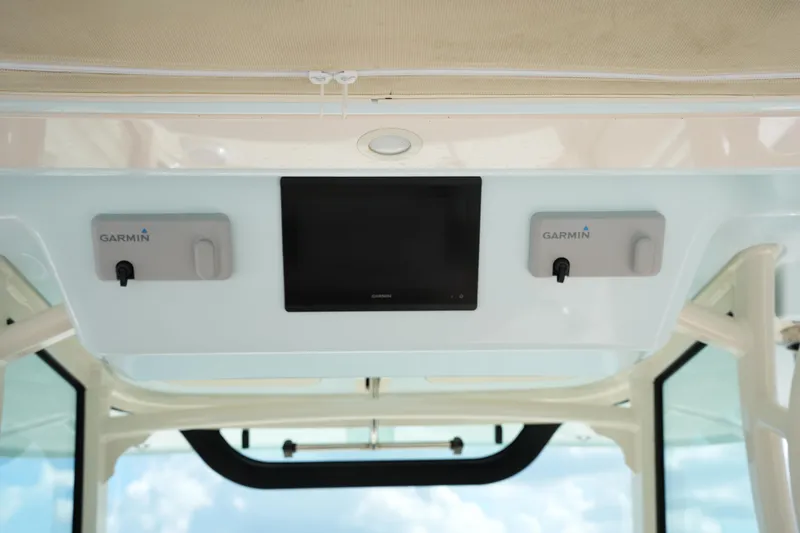 Slide: The Image of 2024 Grady-White Canyon 336 boat with Garmin electronics display. - 25