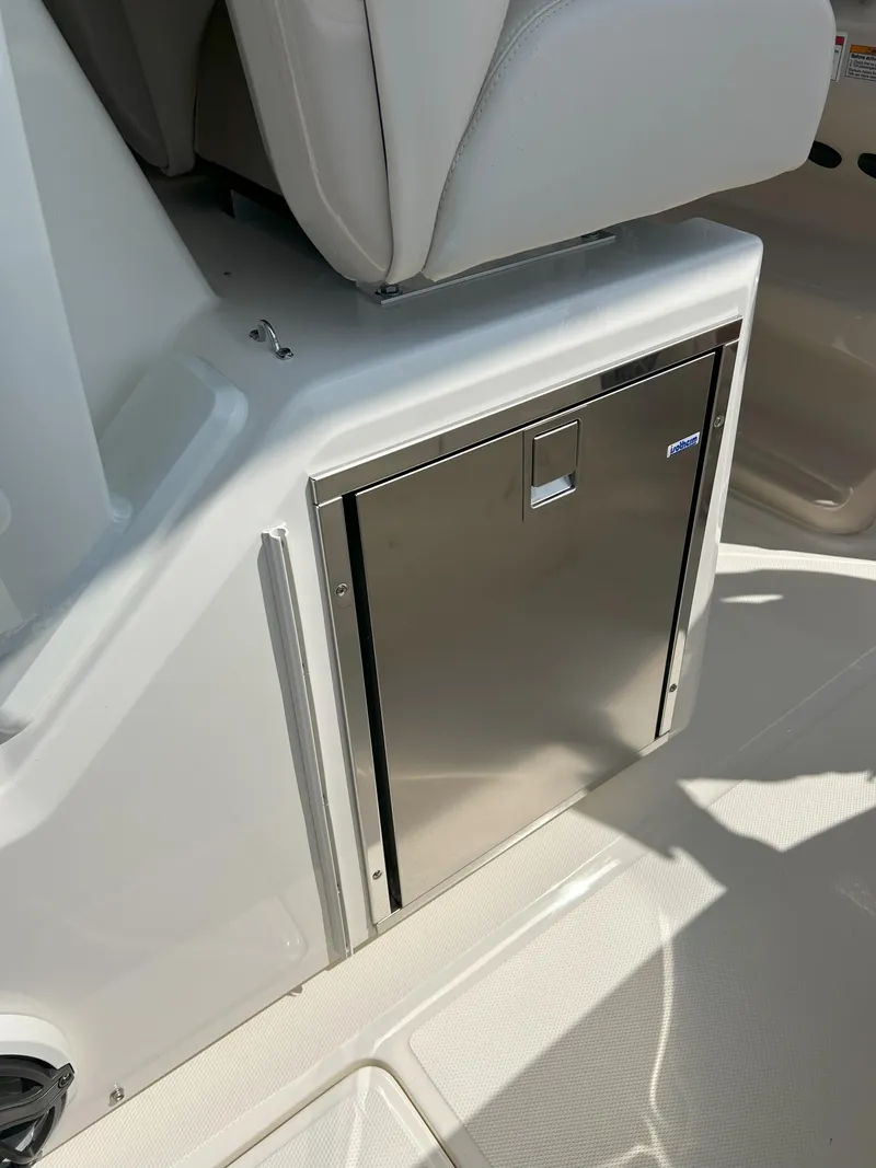Slide: The Image of 2025 Boston Whaler 360 Outrage interior with stainless steel storage compartment. - 24