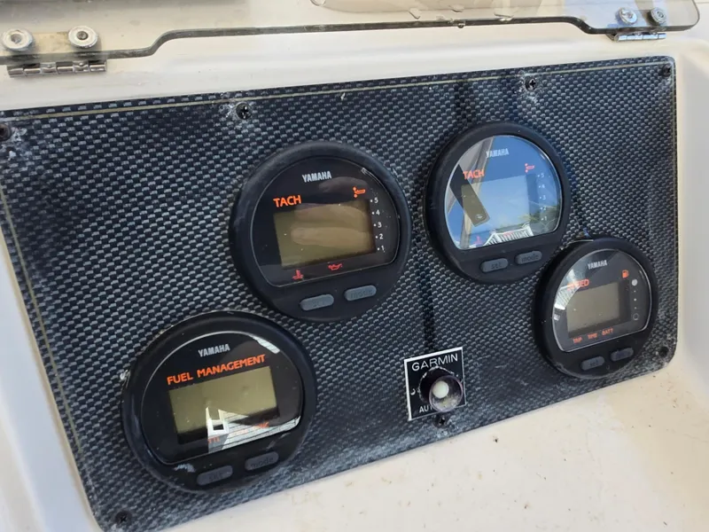 Slide: The Image of Dashboard of a 2003 Grady-White Marlin 300 with Yamaha gauges and Garmin autopilot. - 13