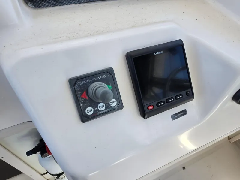 Slide: The Image of Control panel of 2003 Grady-White Marlin 300 with Garmin display and Side-Power joystick. - 15