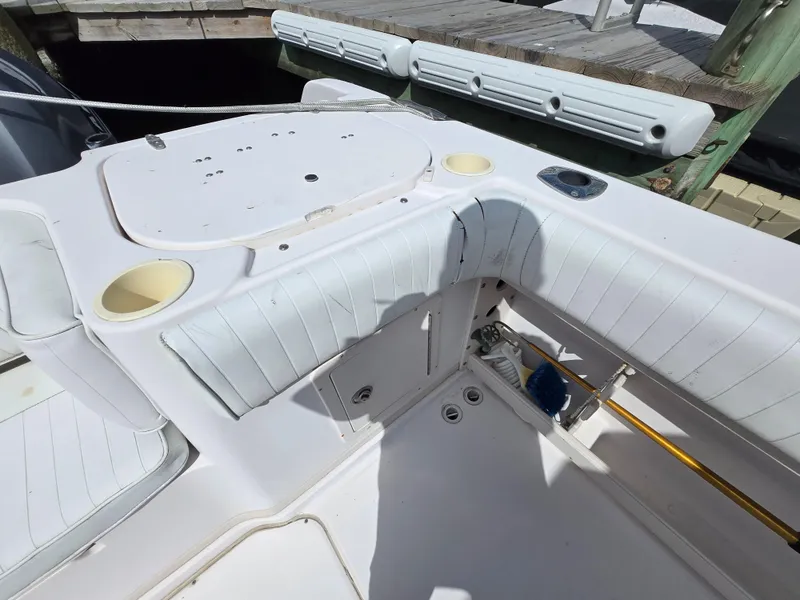 Slide: The Image of 2003 Grady-White Marlin 300 boat interior with seating and storage compartments. - 21
