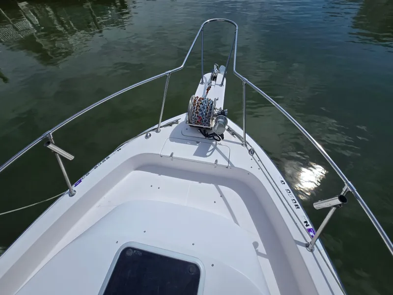 Slide: The Image of Bow of 2003 Grady-White Marlin 300 boat on calm water. - 22