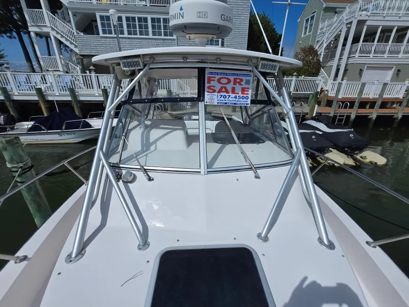 Slide: The Image of 2003 Grady-White Marlin 300 boat for sale at dock, featuring Garmin equipment. - 23