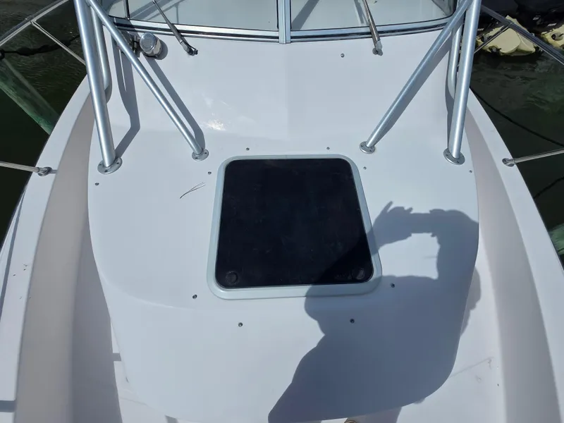 Slide: The Image of 2003 Grady-White Marlin 300 boat deck with hatch and railing. - 24