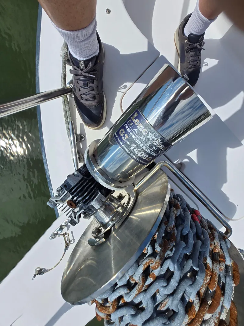 Slide: The Image of Boat anchor winch on 2003 Grady-White Marlin 300, with chain and deck view. - 28