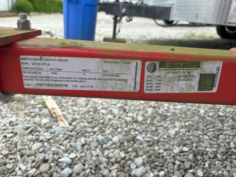 Slide: The Image of Label on a red trailer frame with specifications and safety information. - 9