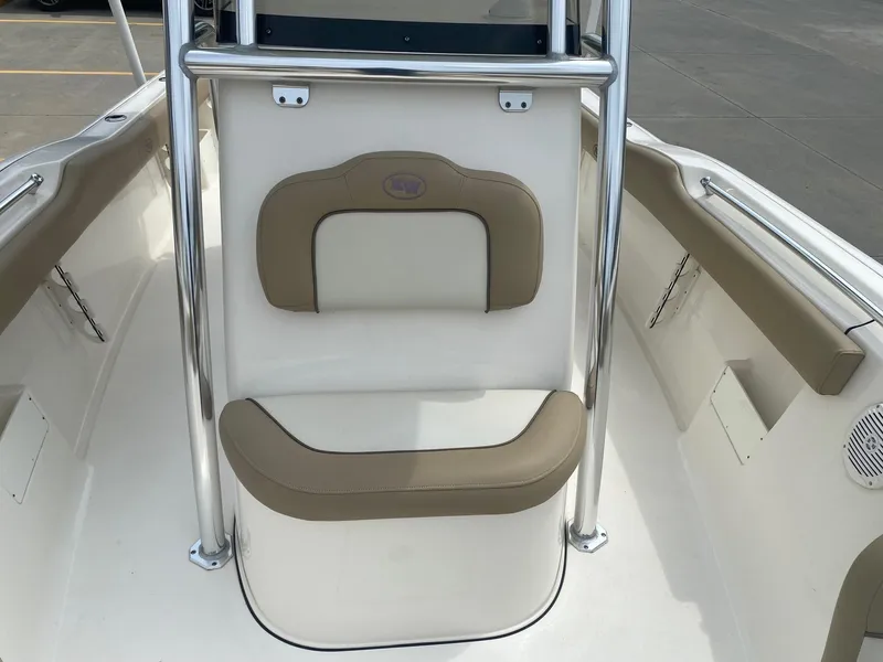 Slide: The Image of 2019 Key West 239 FS boat interior with cushioned seating and stainless steel railings. - 10