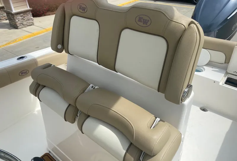 Slide: The Image of 2019 Key West 239 FS boat seating with beige and white upholstery. - 16
