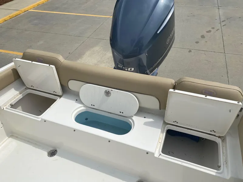 Slide: The Image of 2019 Key West 239 FS boat with Yamaha 250 engine, open storage compartments. - 21