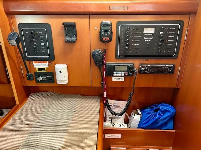 Slide: The Image of Control panel of a 2007 Beneteau 373 sailboat with communication equipment. - 12