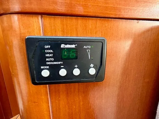 Slide: The Image of Control panel on 2007 Beneteau 373 yacht, featuring climate settings. - 23