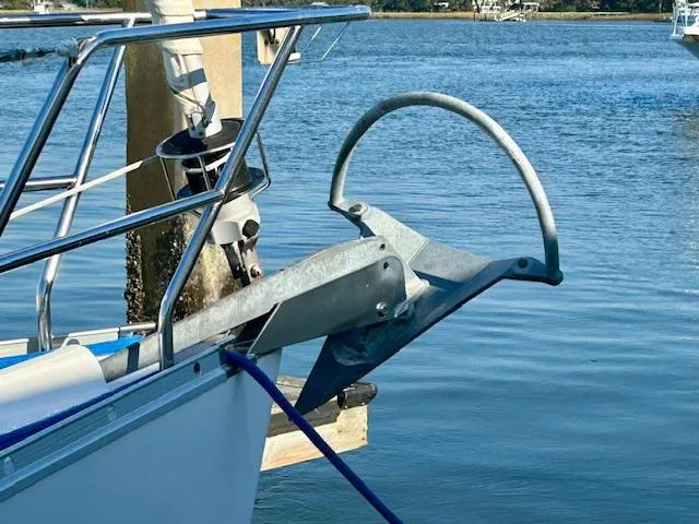 Slide: The Image of 2007 Beneteau 373 sailboat anchor detail by the water. - 3
