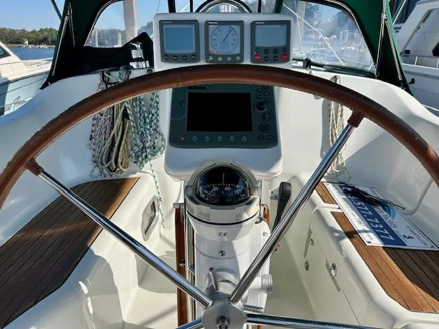 Slide: The Image of 2007 Beneteau 373 sailboat cockpit with steering wheel, navigation instruments, and compass. - 30