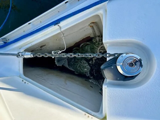 Slide: The Image of Anchor chain and windlass on 2007 Beneteau 373 sailboat deck. - 32