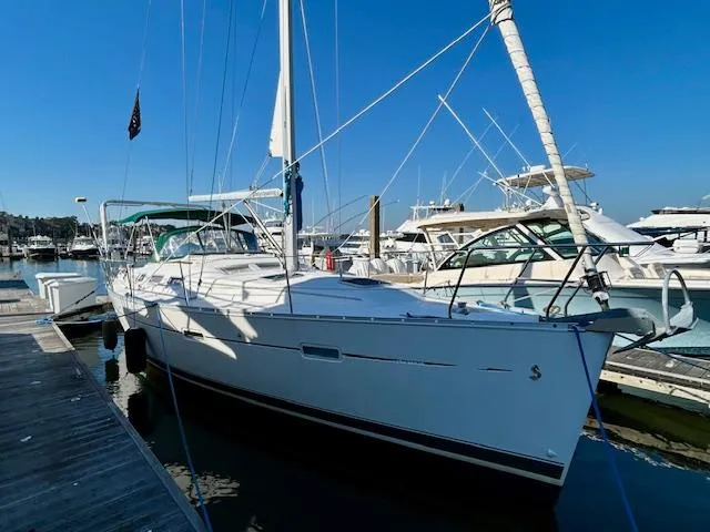 Slide: The Image of 2007 Beneteau 373 sailboat docked at marina under clear blue sky. - 37