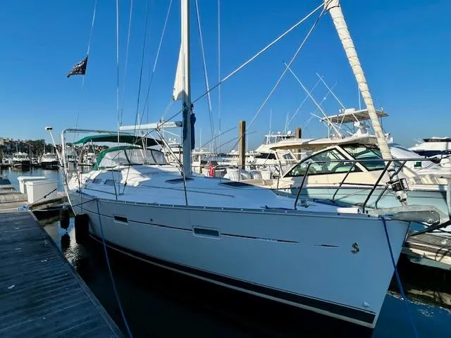 Slide: The Image of 2007 Beneteau 373 sailboat docked at marina under clear blue sky. - 6