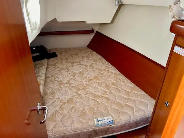 Slide: The Image of Cozy cabin interior of 2007 Beneteau 373 sailboat with comfortable mattress. - 7