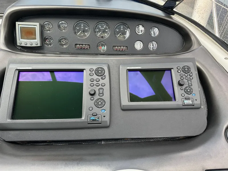 Slide: The Image of Control panel of a 2001 Sunseeker Camargue 44 yacht with navigation screens and gauges. - 11