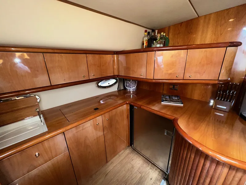 Slide: The Image of Luxurious wooden interior of 2001 Sunseeker Camargue 44 yacht kitchen area. - 15