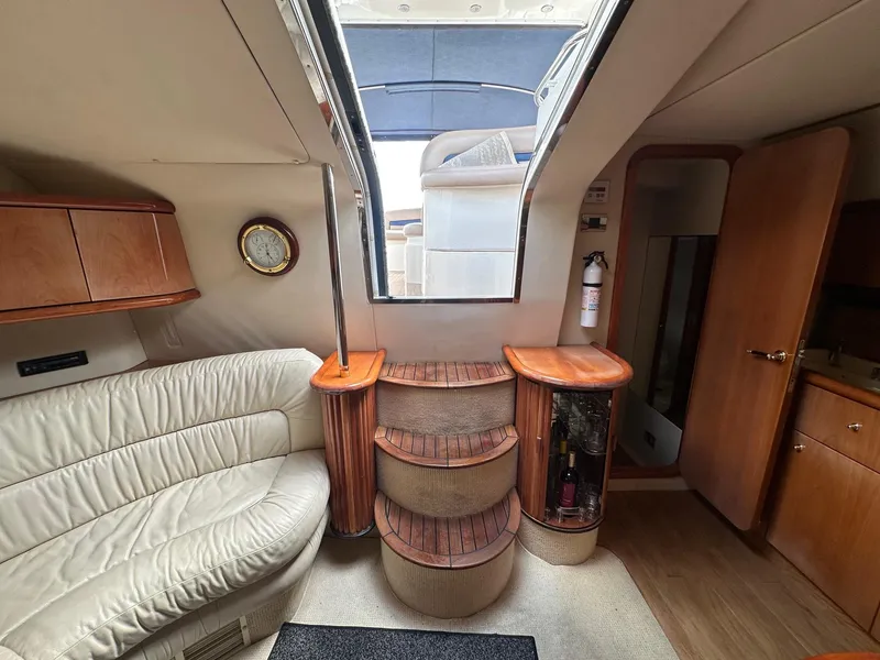 Slide: The Image of Interior of 2001 Sunseeker Camargue 44 yacht with elegant seating and wooden accents. - 18