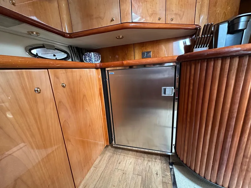 Slide: The Image of Luxurious wooden interior of 2001 Sunseeker Camargue 44 yacht kitchen area. - 19
