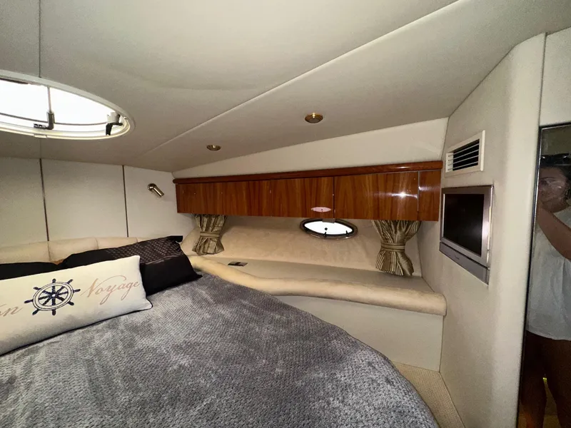 Slide: The Image of Luxurious cabin interior of 2001 Sunseeker Camargue 44 yacht with cozy bed and porthole. - 24