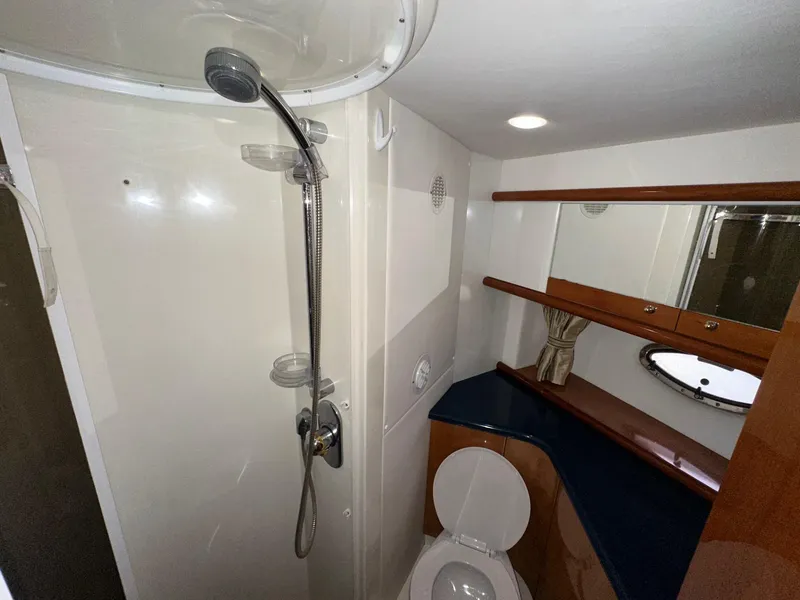 Slide: The Image of Bathroom interior of 2001 Sunseeker Camargue 44 yacht, featuring shower and toilet. - 27