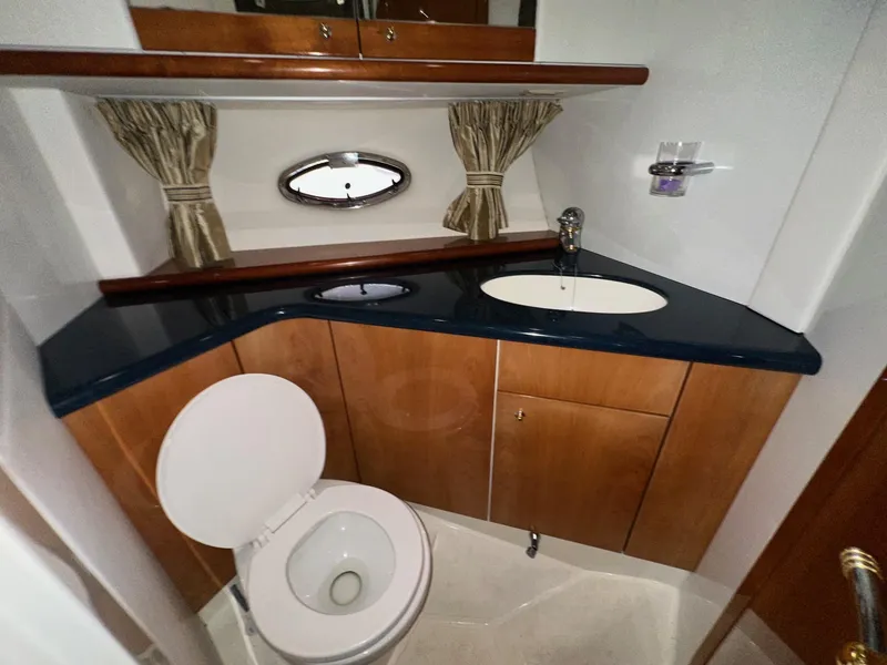 Slide: The Image of Bathroom interior of 2001 Sunseeker Camargue 44 yacht with sink and toilet. - 28