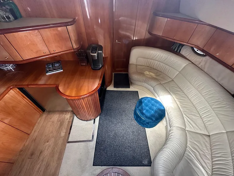 Slide: The Image of Luxurious interior of 2001 Sunseeker Camargue 44 yacht with leather seating and wooden cabinetry. - 33