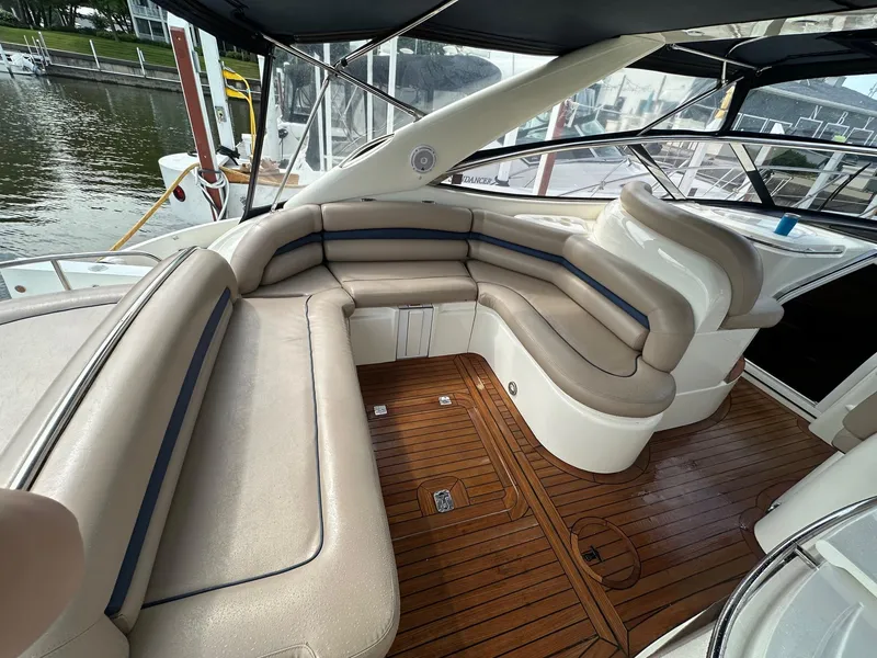 Slide: The Image of Luxurious seating area on a 2001 Sunseeker Camargue 44 yacht with wooden deck. - 34