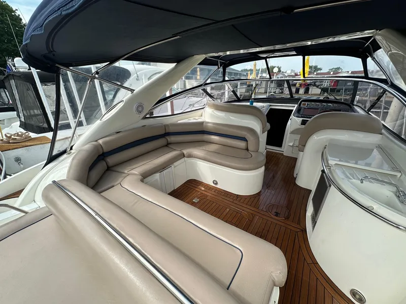 Slide: The Image of Luxurious 2001 Sunseeker Camargue 44 yacht interior with elegant seating and wooden flooring. - 35