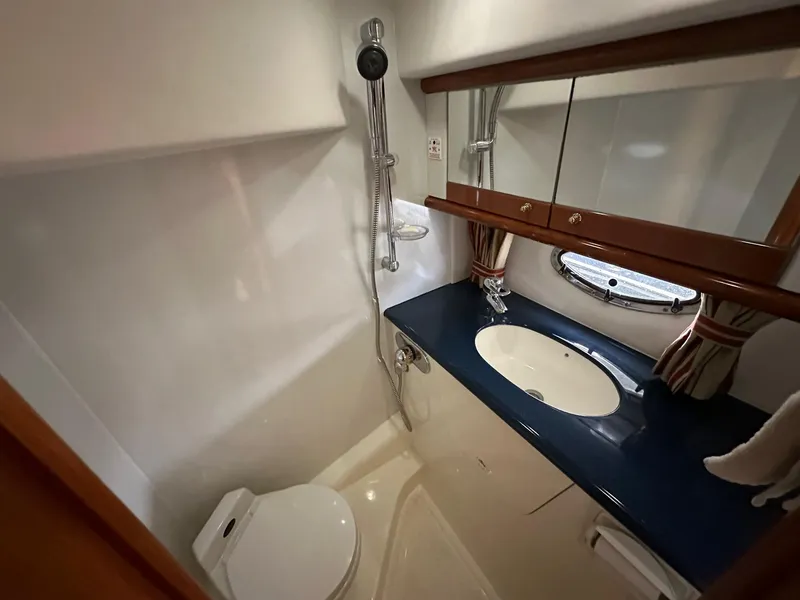Slide: The Image of Luxurious bathroom in 2001 Sunseeker Camargue 44 yacht with shower, sink, and toilet. - 40