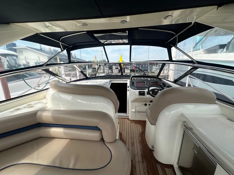 Slide: The Image of Interior view of 2001 Sunseeker Camargue 44 yacht with luxurious seating and modern dashboard. - 7