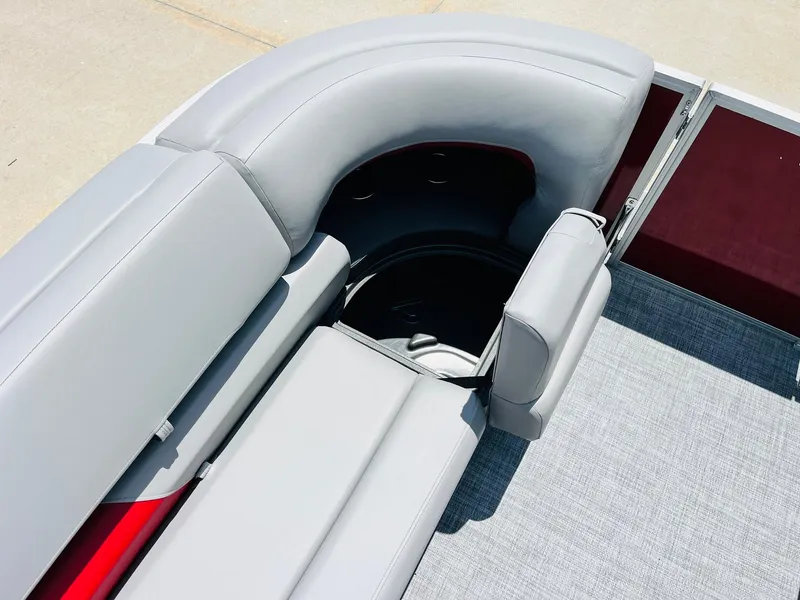 Slide: The Image of 2026 Sun Tracker Party Barge 20 DLX interior seating with storage compartment. - 19