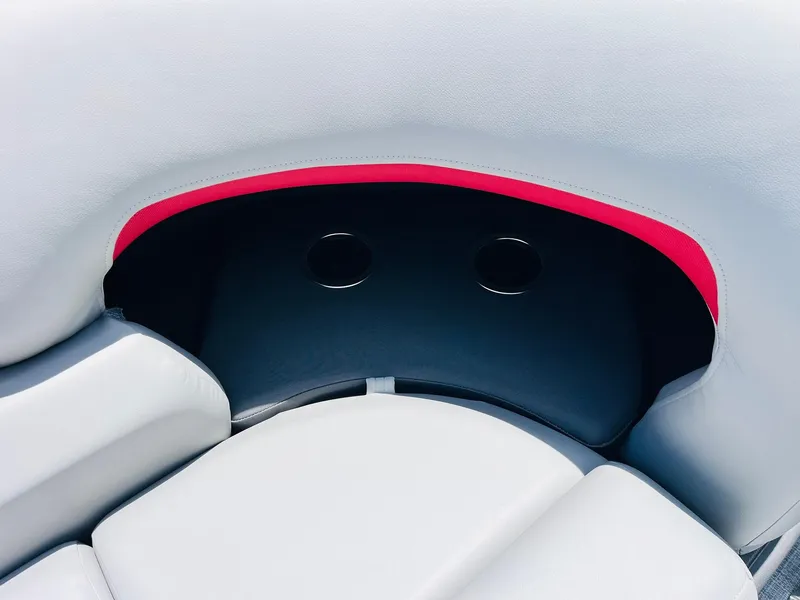 Slide: The Image of 2026 Sun Tracker Party Barge 20 DLX seating with cup holders and red accent. - 25