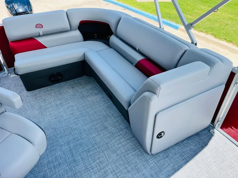 Slide: The Image of 2026 Sun Tracker Party Barge 20 DLX interior with gray and red seating. - 29