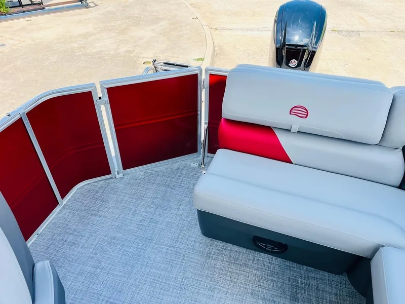 Slide: The Image of 2026 Sun Tracker Party Barge 20 DLX interior with red accents and comfortable seating. - 37