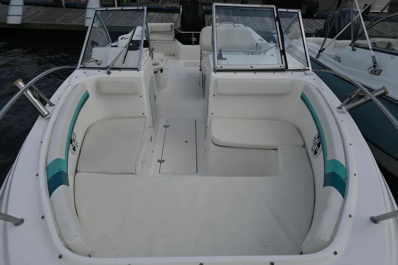Slide: The Image of 1999 Aquasport 215 Dual Console boat with spacious seating and open deck design. - 15