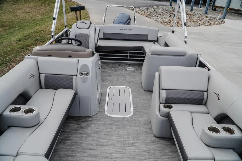 Slide: The Image of 2021 Bennington 22SSBXP pontoon boat interior with plush seating and cup holders. - 12