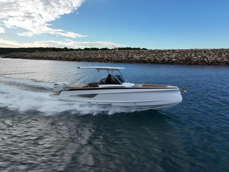 Slide: The Image of 2026 STERK 31 WB Super Sport boat cruising on water under a clear blue sky. - 13