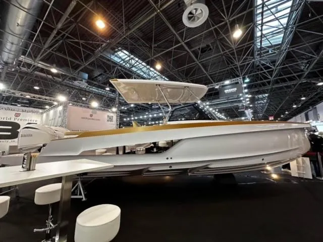 Slide: The Image of 2026 STERK 31 WB Super Sport boat displayed at an indoor exhibition. - 18